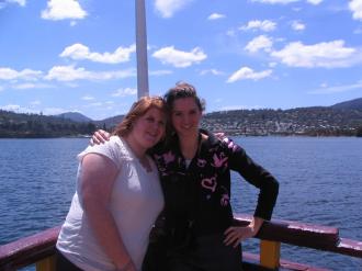 Lisa McClintock and Vicky Argyle posing on the bow of the boat