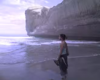 Valerie staring out to sea at Tunnel Beach