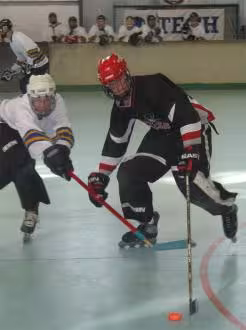 Stu McLennan trying to get the puck off a Redback