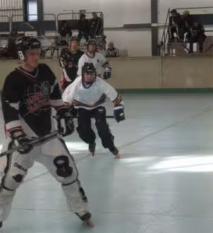 Ryan Hellyer (me) with the orange wheels swooping in on a Redback player