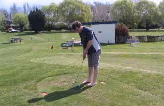 Jason Sedgwick playing mini-golf