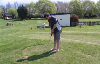 Jason Sedgwick playing mini-golf