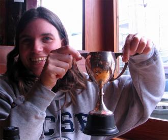 Shelley MacDonell holding Ryan Hellyer’s badminton cup