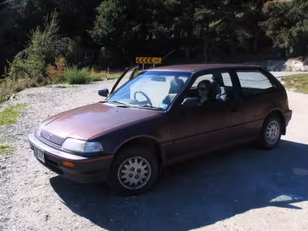 The mighty Honda Civic at the top of the zigzag on the Crown Range