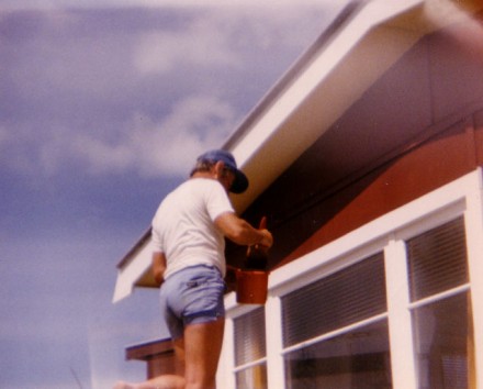 My Dad painting the crib