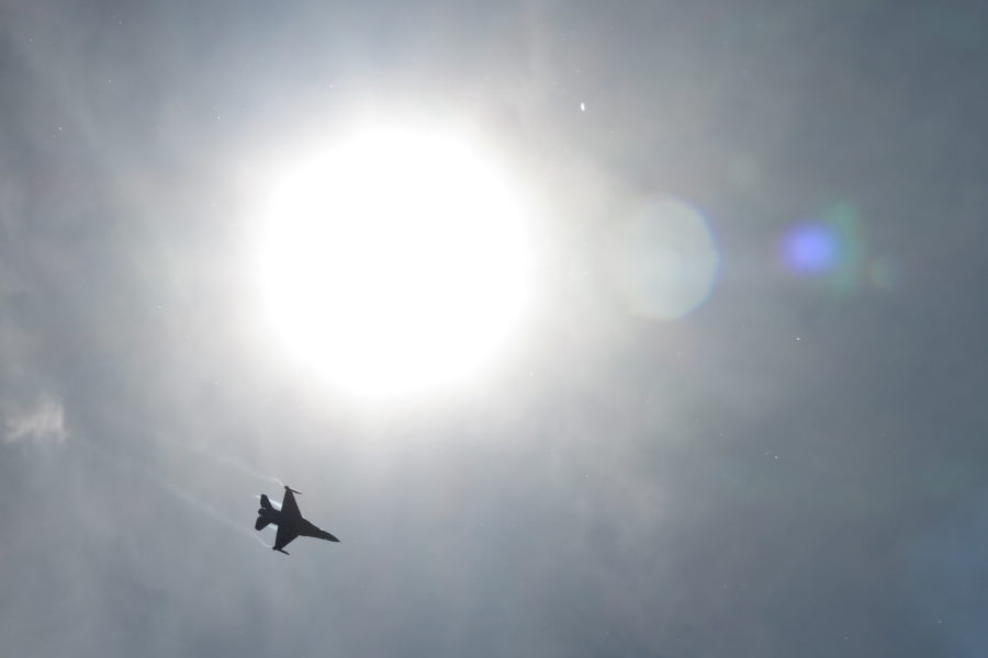 F16 fighter jet against the sun
